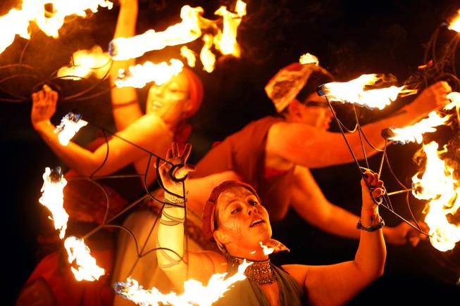 Fire dancers perform leading to the burn of Lucky Lady ...