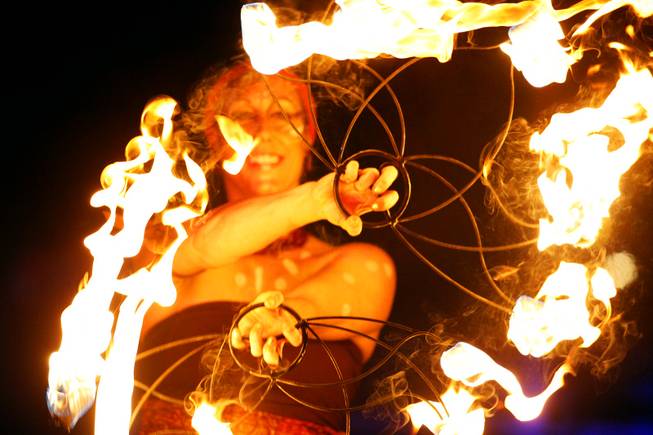 A fire dancer performs leading to the burn of Lucky ...