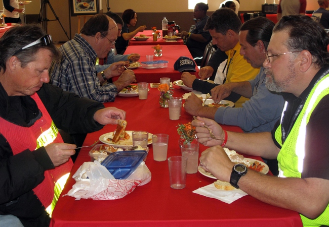 Residents of the Las Vegas Rescue Mission enjoy a free meal through the monthly "Dinner On Us" event. The March theme was Italian food.