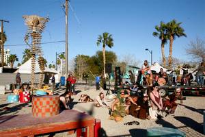 Workers and performers prepare for the burn of "Lucky Lady Lucy" in downtown Las Vegas on Friday, March 2, 2012. 