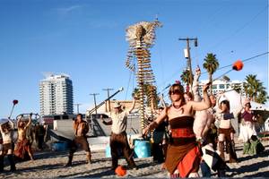 Workers and performers prepare for the burn of "Lucky Lady Lucy" in downtown Las Vegas on Friday, March 2, 2012. 