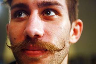 Chase Hackett of Littleton, Co. shows off his mustache during a press conference to announce the cast of UFC's 