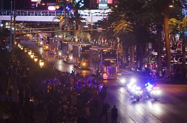Metro Police officers lead a NASCAR hauler parade on Las Vegas Boulevard Thursday, March 8, 2012.