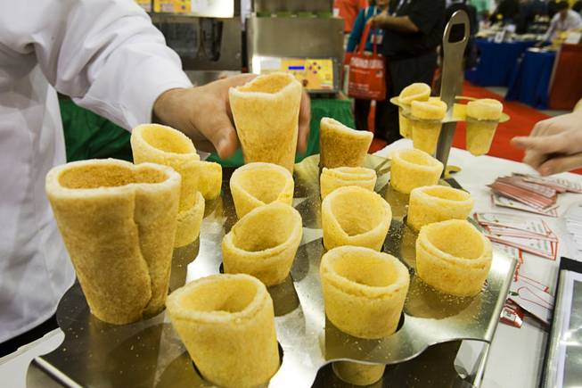 Edible pizza cones are displayed at the Conocopia booth during the International Pizza Expo at the Las Vegas Convention Center Wednesday, March 14, 2012. The cones can be filled with pizza fixings or a variety of other fillings.