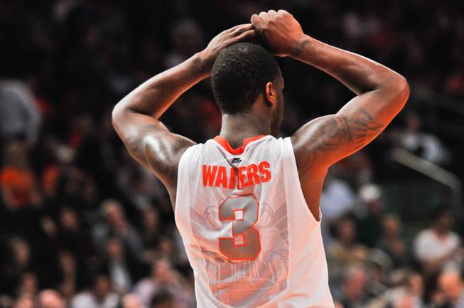 Syracuse Orange guard Dion Waiters holds his hands on his head in frustration late in the 2nd half of the semi-final game 1 of the 2012 Big East Tournament . Cincinnati Bearcats upset SU at Madison Square Garden by beating the Orange 71-68.