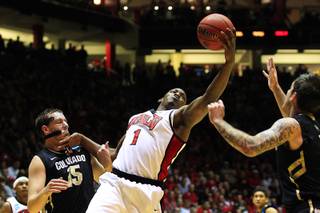UNLV forward Quintrell Thomas grabs his own rebound against Colorado during their second round NCAA Men's Basketball Championship game Thursday, March 15, 2012 at The Pit in Albuquerque.