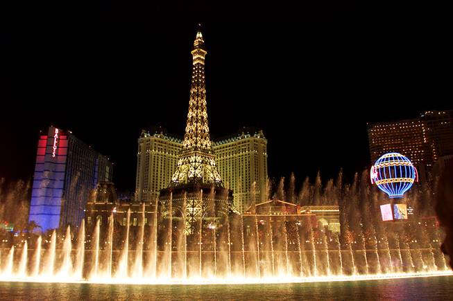The fountains of the Bellagio hotel-casino go off across the street from the Paris Las Vegas hotel-casino Wednesday, September 1, 1999, during the opening of the hotel-casino. 