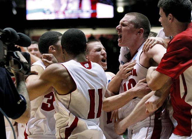 Wisconsin players celebrate as time expires during the second half of an NCAA tournament third-round college basketball game againt Vanderbilt, Saturday, March 17, 2012, in Albuquerque, N.M. Wisconsin won 60-57.