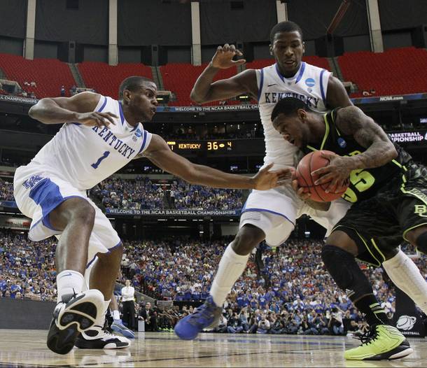 Baylor's Pierre Jackson (55) drives against Kentucky's Michael Kidd-Gilchrist, center, and Kentucky's Darius Miller during the first half of an NCAA tournament South Regional finals college basketball game Sunday, March 25, 2012, in Atlanta. 