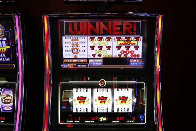 A Blazing Sevens slot machine by Bally Technologies is displayed in the company's showroom Thursday, March 29, 2012.