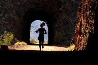 Candace Jones runs through the tunnels to Hoover Dam near Boulder City on Friday, March 30, 2012.