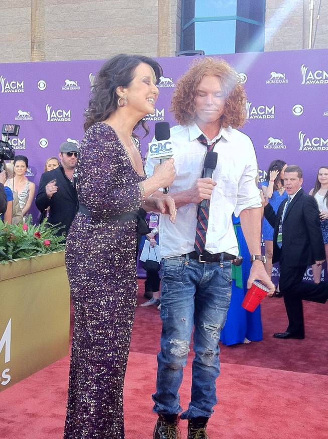 Carrot Top, contemplating an answer on the 2012 ACM Awards red carpet. The guy in the background is his publicist, Steve Flynn.