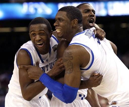 From left, Kentucky guard Doron Lamb, forward Terrence Jones (3) and guard Marquis Teague celebrate after the NCAA Final Four tournament college basketball championship game Monday, April 2, 2012, in New Orleans. Kentucky won 67-59.