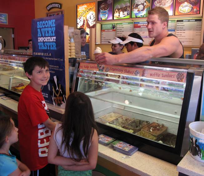 Chippendale Kyle Efthemes serves free cones at Ben & Jerry's at The District. It was free-cone day to celebrate the company's 34th anniversary. Donations benefited St. Jude's Ranch for Children in Boulder City.