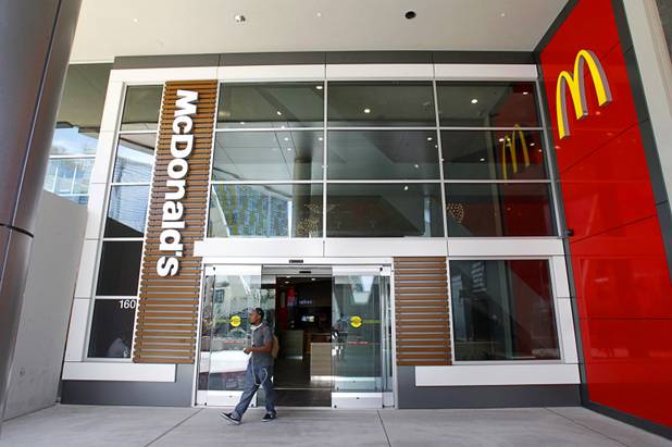 A customer leaves the new Metro McDonald's at Harmon Avenue and the Las Vegas Strip Thursday, April 19, 2012. The 24-hour restaurant, with a second floor dining area, will host it's grand opening to the public on Friday, May 4 at midnight to 6 a.m.