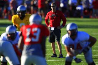 UNLV head coach Bobby Hauck watches his team during the Rebels spring football game Friday, April 20, 2012.
