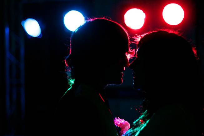 Two dancers embrace for a kiss at Mojave High School ...