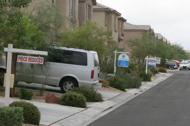 Foreclosed homes for sale line the 9800 block of Fast Elk Street in northwest Las Vegas in 2007.
