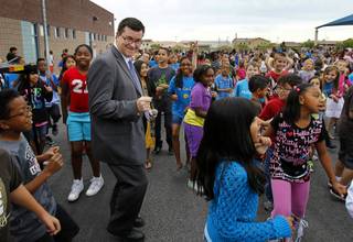 Goynes Elementary School principal Jefferey Hybarger joins students as they perform the 