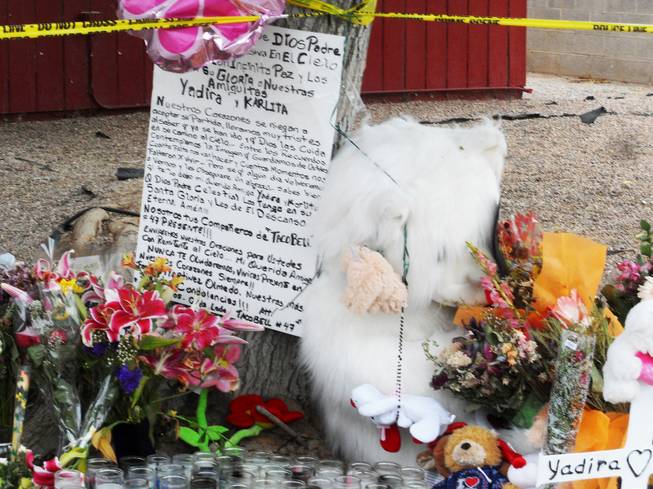 Shown is the memorial on April 25, 2012 that has been made for the mother and daughter found dead inside their home on Robin Street near Washington Avenue. On April 16, 2012, officers responded to the house when a boy, 9, went to school and told staff that his mother and sister were dead at home.