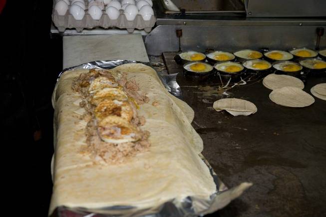 This 2-foot-long burrito from White Rabbit Food Truck is enclosed in six tortillas and contains six eggs, 3 pounds of meat, six scoops of rice and 12 slices of cheese. 