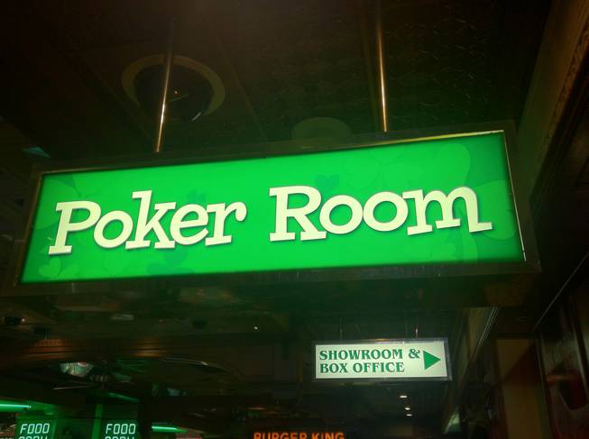 The Poker Room sign, illuminating action at four tables, at O'Sheas.