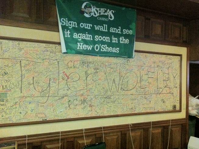 Wall scrawl dominated by one Tyler Wolfey hangs from the wall at O'Sheas.