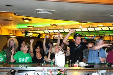 O’Sheas customers give a final toast and cheer before the doors close at noon Monday, April 30, 2012.