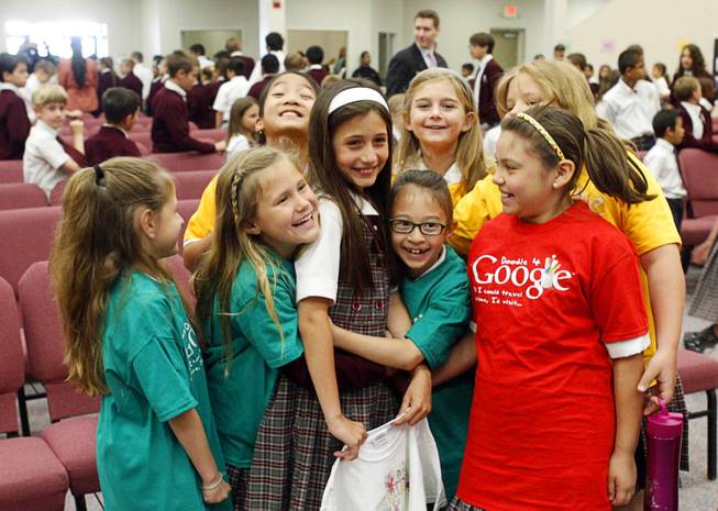 Third grader Sofia Legisima is congratulated by classmates after being ...