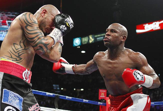 Mayweather takes title from Cotto
