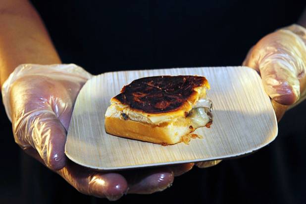 A Sensi pate melt  by chef Roy Ellamar, with country pate, aged goat cheese, King's Hawaiian sweet bread and fig mostarda, is displayed during the Vegas Uncork'd "Follow That Truck" food festival at the Bellagio Thursday May 20, 2012. Celebrity chefs added to the gourmet fare from more than a dozen food trucks for the festival outside under the lights at Bellagios Hidden Drive.