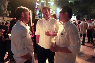 Chef Laurent Pillard from Fleur de Lys talks with Eric Beriin, center, and Andre Fru during the Vegas Uncork'd Grand Tasting Friday, May 11, 2012 at Caesars.
