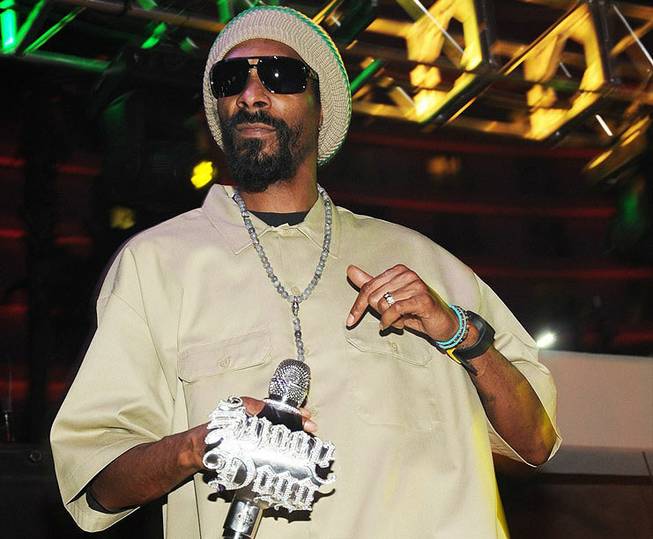 Snoop Dogg performs at the Soundwaves poolside stage at the Hard Rock Hotel on Saturday, May 12, 2012. His wax figure was on loan from Madame Tussauds for his concert.