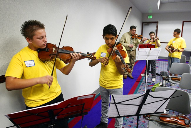 Von Tobel Middle School students Jovany Castanon, left, and Marcelino Cruz practice during a mariachi workshop led by members of Mariachi Cobre at Cashman Field Center Thursday, May 17, 2012. The students and Mariachi Cobre, from Walt Disney World's Epcot Center, will perform in the Las Vegas Latin Chamber of Commerce Mariachi Festival at the Smith Center for the Performing Arts Friday, May 18. 