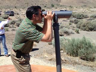 Gov. Brian Sandoval looking at pelicans at Pyramid Lake last week.