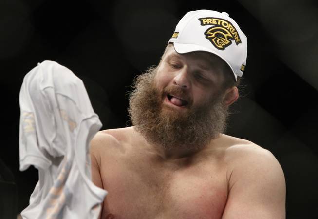 Roy Nelson of Las Vegas puts on his shirt after knocking out Dave Herman of Temecula, Calif. during UFC 146 at the MGM Grand Garden Arena Saturday, May 26, 2012.