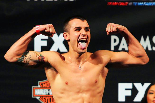 Myles Jury sticks out his tongue during the weigh in for The Ultimate Fighter 15 Thursday, May 31, 2012.