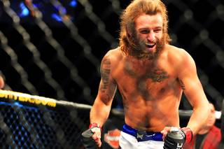 Mike Chiesa celebrates his submission victory over Al Iaquinta in their lightweight bout at The Ultimate Fighter 15 Friday, June 1 2012.