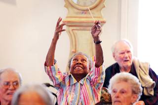 Resident Elnora Holland gets excited during a Conductorcise session with Maestro David Dworkin at the Cottages of Green Valley in Henderson on Friday, June 8, 2012.