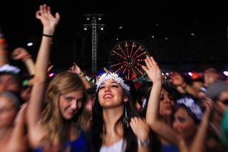 Concertgoers dance during the first night of the Electric Daisy Carnival early Saturday, June 9, 2012, at Las Vegas Motor Speedway.