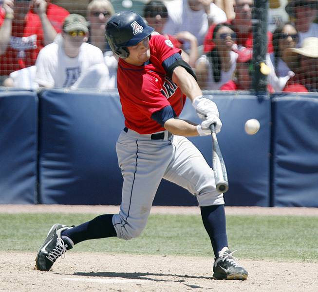 Sophomore Johnny Field makes contact in the second inning during a game against St. John's in Game 2 of the NCAA super regionals at Hi Corbett Field. Field leads Arizona with a .383 batting average.