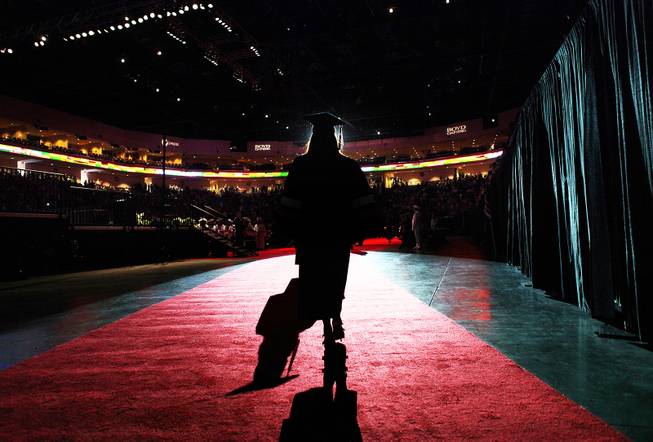 A student walks out into the arena during the Chaparral High School commencement ceremony at the Orleans Arena on Friday, June 15, 2012.
