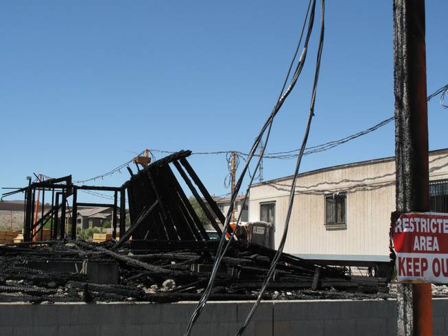 Signs and poles near Wigwam Street were scorched by an early morning fire at an apartment construction site. Fire crews responded to an early morning fire at 1131 Wigwam St., the future site of Theory Apartments on Wednesday , June 20, 2012.