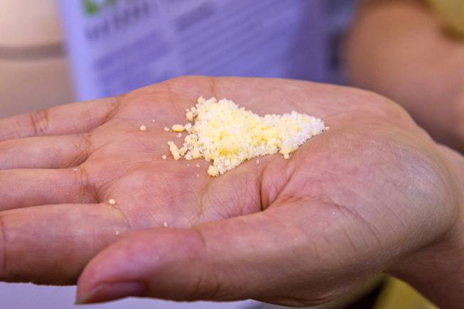 A blend of Dead Sea salt and cheddar cheese flavoring (for popcorn) is displayd at the Salona booth during the IFT Food Expo at the Las Vegas Convention Center, June 25, 2012. The salt is healthier than regular table salt because it has more magnesium chloride and potassium chloride and less sodium chloride, a representative said.