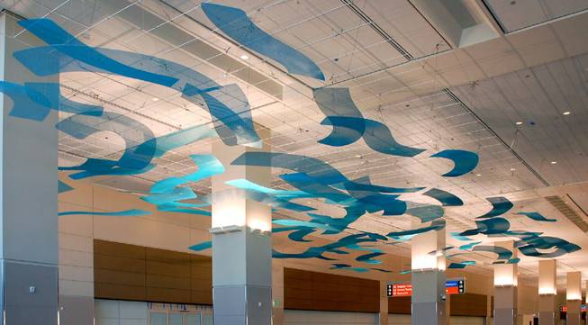 "Blue Arroyo" is a hanging installation by father and daughter sculptor duo Rob and Talley Fisher on display at Terminal 3. The county budgeted $5 million for Terminal 3 at McCarran Airport.