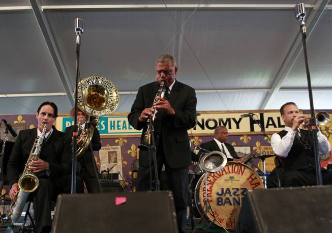 In this Saturday, May 5, 2012 photo, the Preservation Hall Jazz Band performs at the New Orleans Jazz and Heritage Festival in New Orleans. For five decades, Preservation Hall has served up New Orleans jazz for music lovers the world over. The New Orleans Jazz and Heritage Festival, on its closing weekend, marked that achievement by showcasing the world-renowned Preservation Hall Jazz Band in concert twice. 