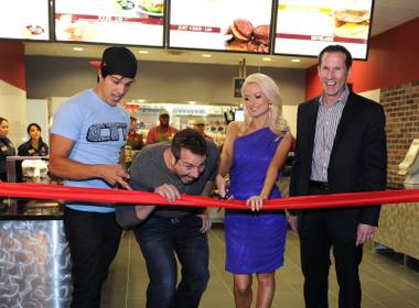 Ricardo Laguna, Joey Fatone, Holly Madison and Steve Heeley during the ribbon cutting for the Earl of Sandwich grand opening at the Palms on Monday, July 2, 2012.