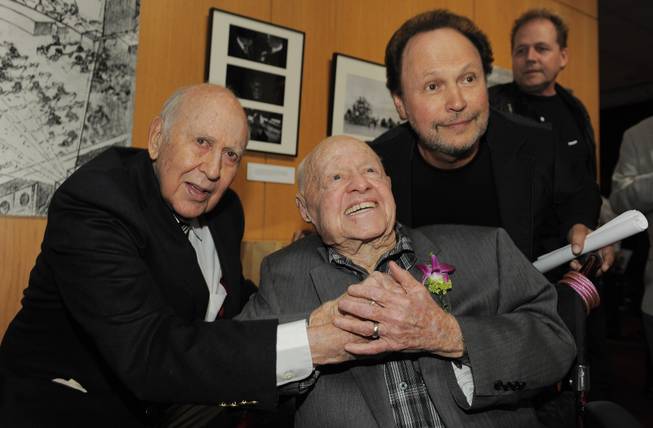 Moderator Billy Crystal, right, poses with "It's a Mad, Mad, Mad, Mad World" cast members Carl Reiner, left, and Mickey Rooney at the kick-off of The Last 70mm Film Festival Presented by the Academy of Motion Picture Arts and Sciences, Monday, July 9, 2012, at the Samuel Goldwyn Theater in Beverly Hills, Calif.