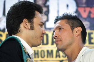 Undefeated WBC middleweight champion Julio Cesar Chavez Jr., left,  of Mexico and Sergio Martinez of Argentina face off during a news conference at the Wynn Las Vegas Wednesday July 11, 2012. Chavez will defend his title against Martinez at the Thomas & Mack Center in Las Vegas September 15 - Mexican Independence Day.