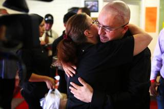 Arturo Martinez hugs family friend Billie Walker before a press conference at his gym the Real KO Boxing Club in North Las Vegas on Thursday, July 12, 2012. Martinez's wife and 10-year-old daughter were beaten to death in their home in April 2012, and Martinez was hospitalized with severe head injuries from the attack.